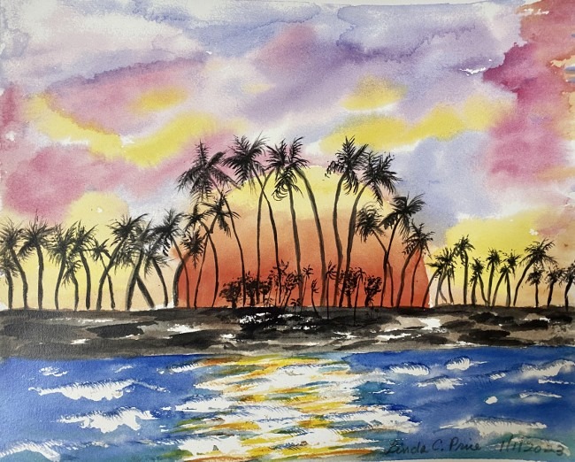 looking out over the water at an island of palm trees silhoetted by the sunset.