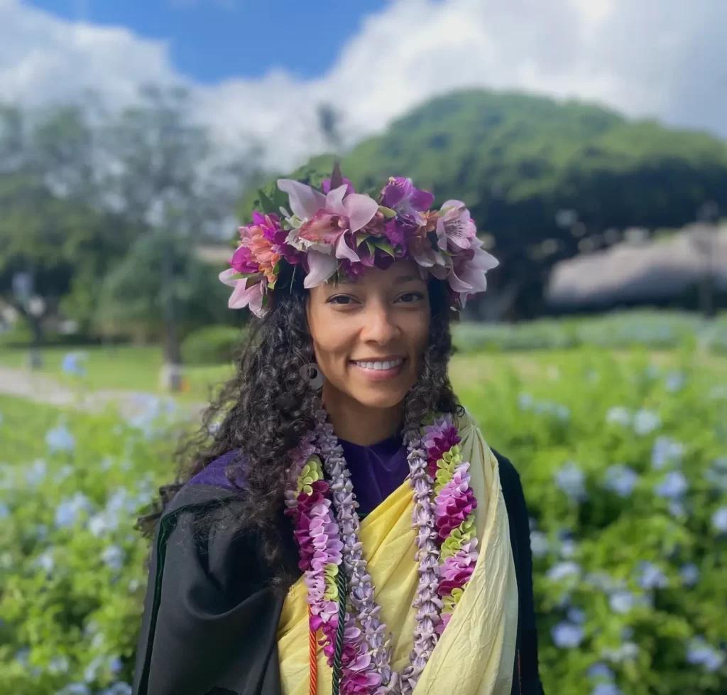 Picture of Ms. Naima Te Maile Fifita with a flower lei around her head