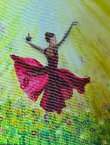 Woman dancint in a pink dress the sun shining down on her in a field with flowers all around her